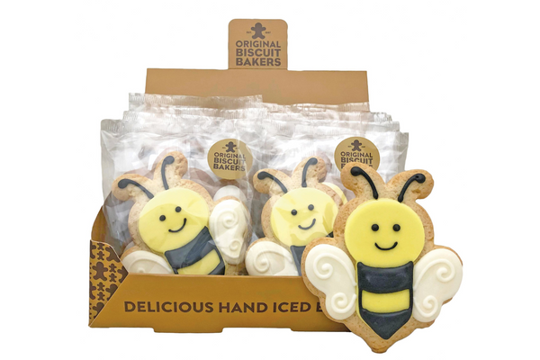 Image of a box of sugar cookies shaped and iced like bumblebees.